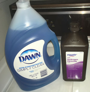 how to clean baseball pants - Image of a bottle of peroxide and a bottle of Dawn dish detergent