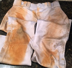how to clean baseball pants - Image of a dirty pair of baseball pants.